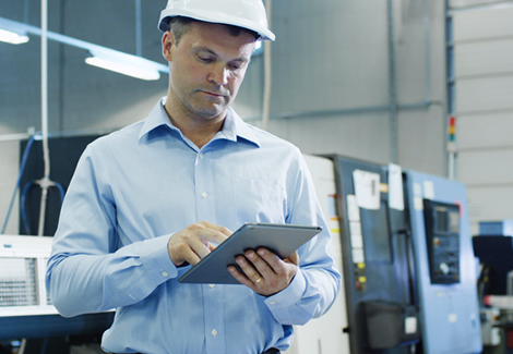 man looking at a board